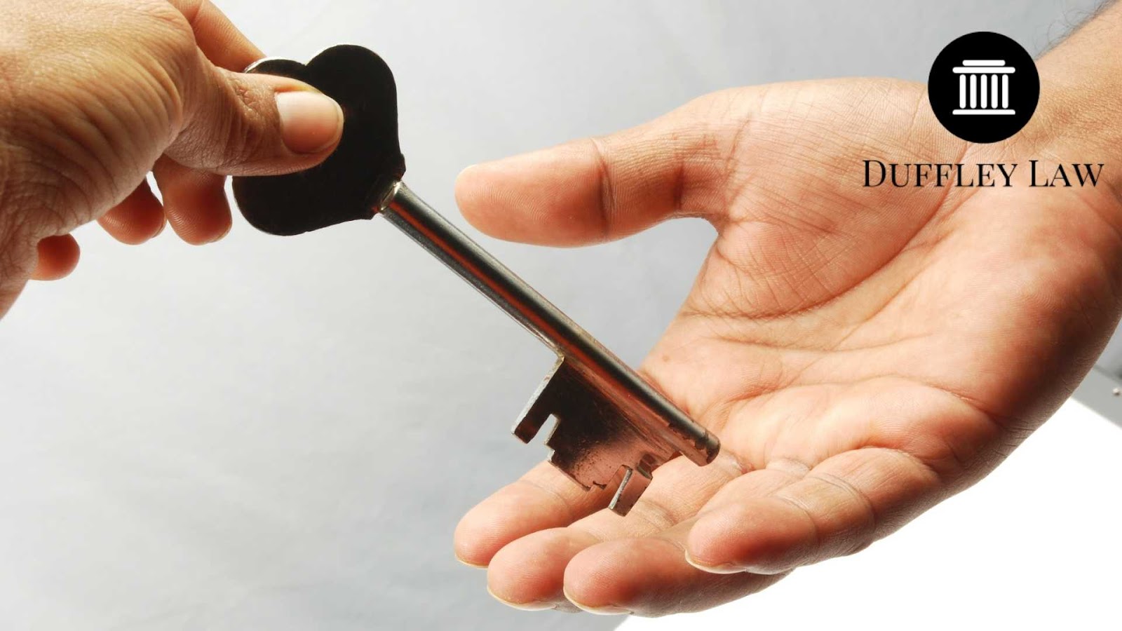 Key of an estate handed over in partnership gesture