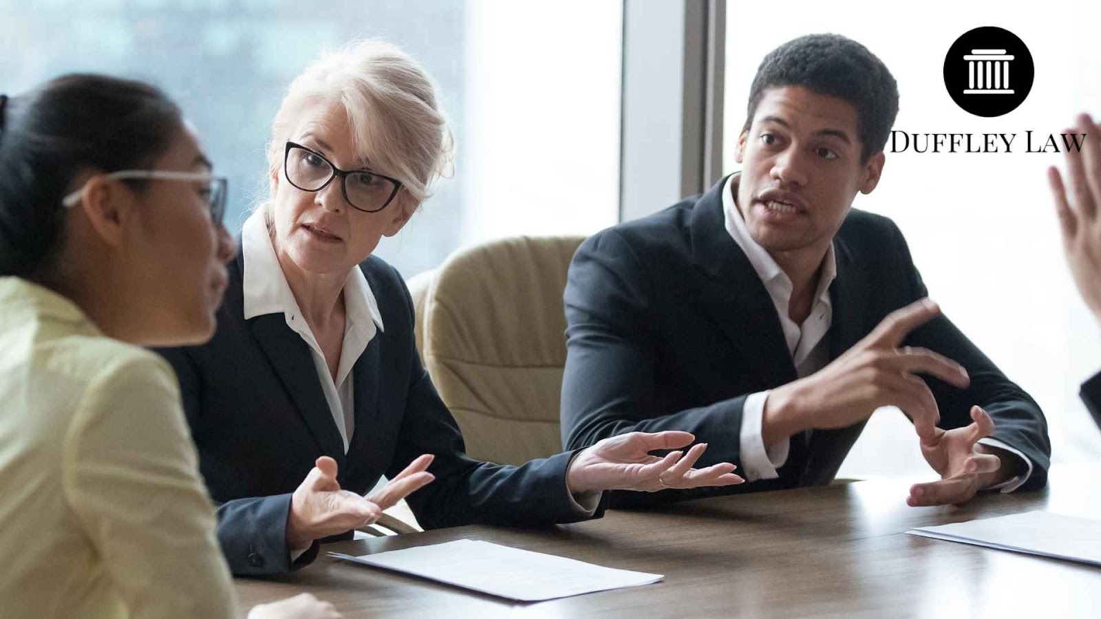 Lawyers in a meeting discussing an estate plannign case.