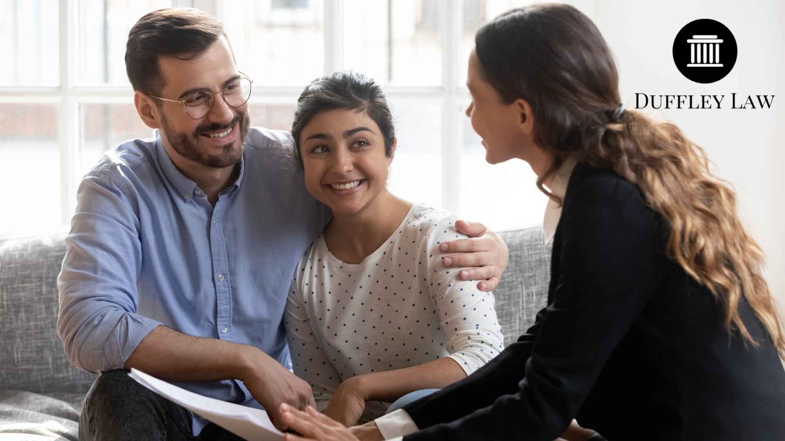 Couple consulting with a lawyer indoors.