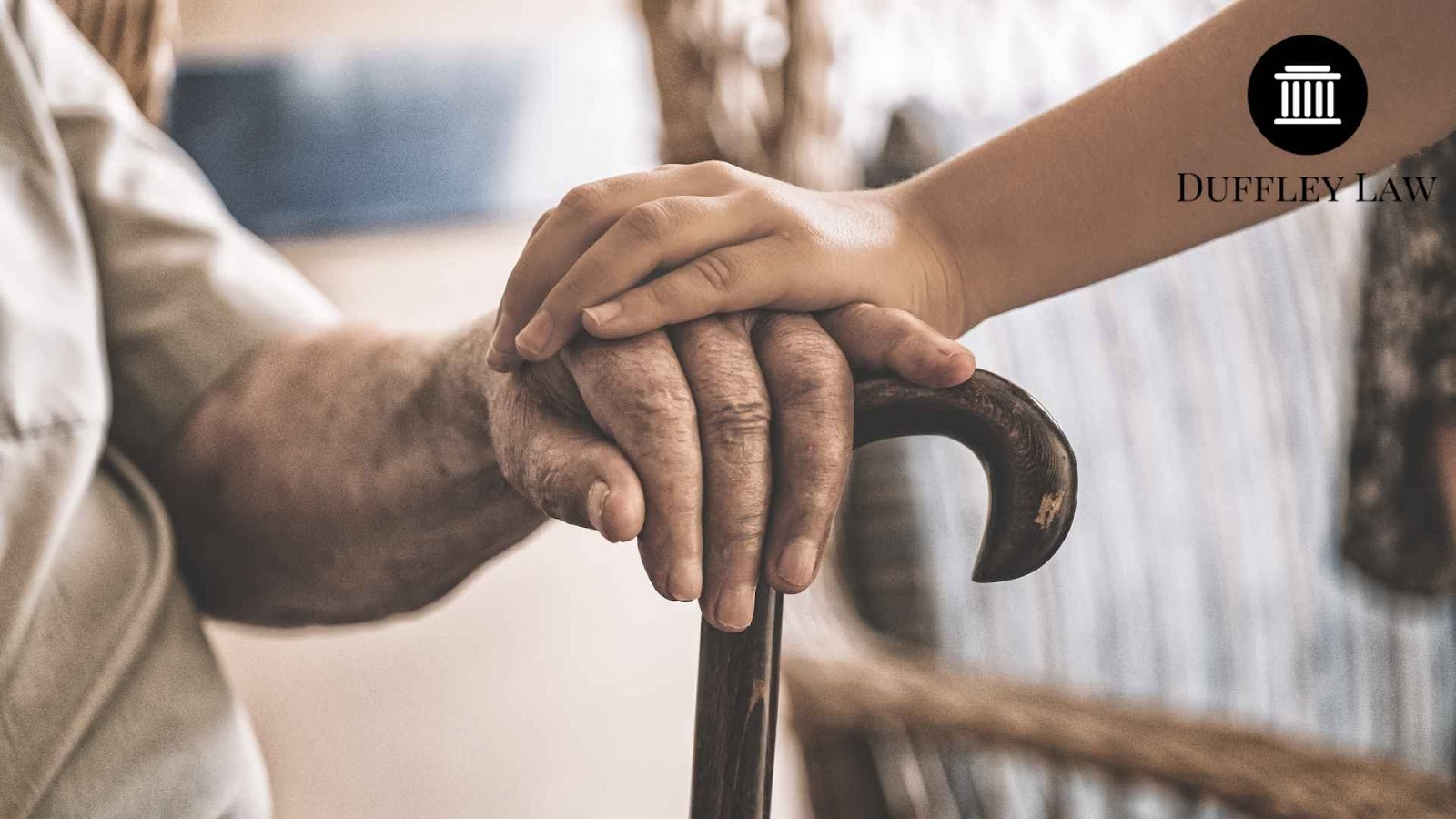 Hands on cane symbolizing care and support