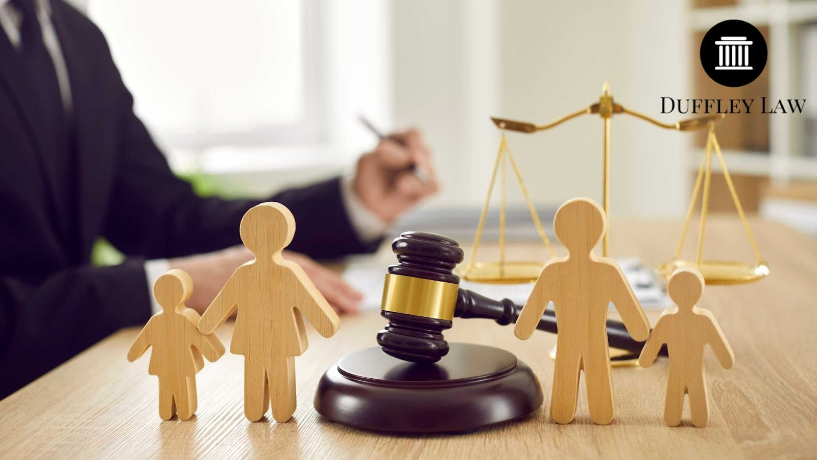 Wooden family figures, gavel, scales of justice.