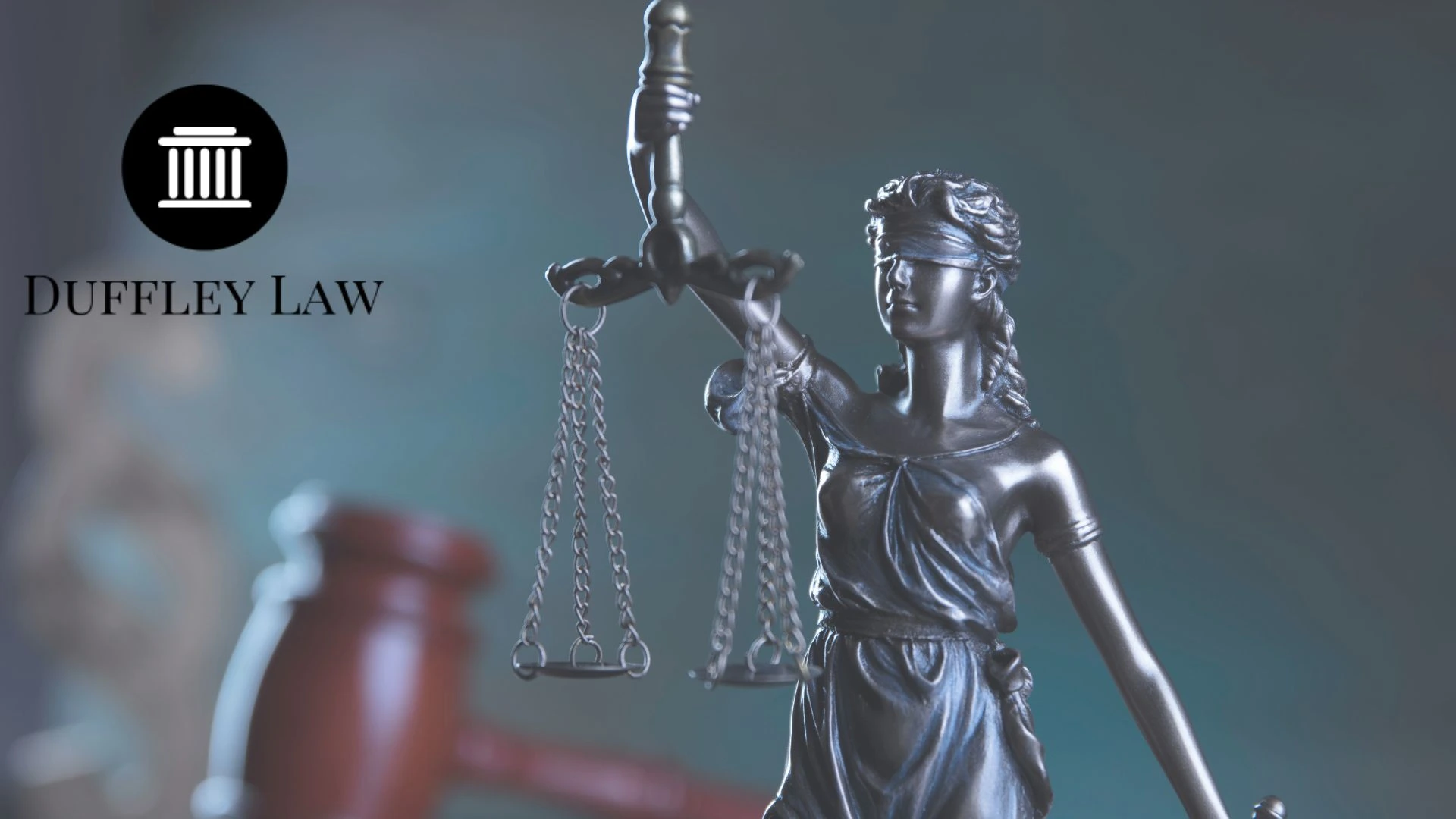 Lady Justice statue with scales and gavel