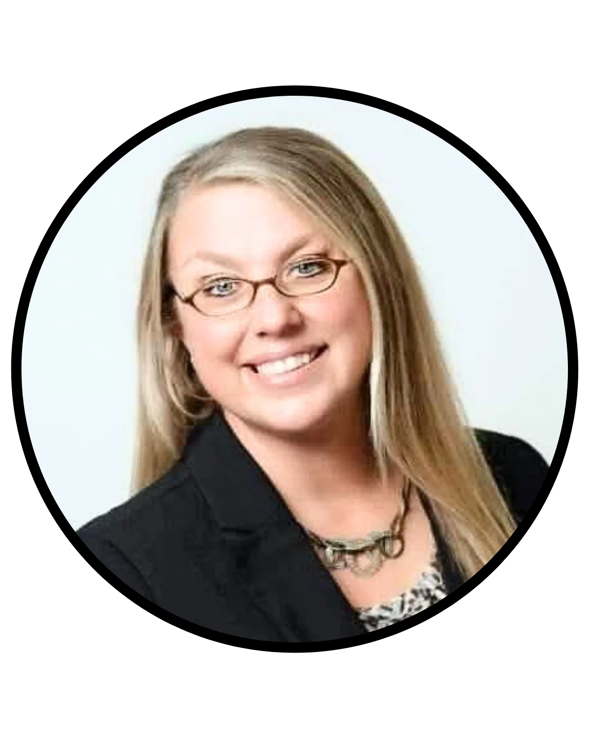 Smiling woman with glasses in professional headshot